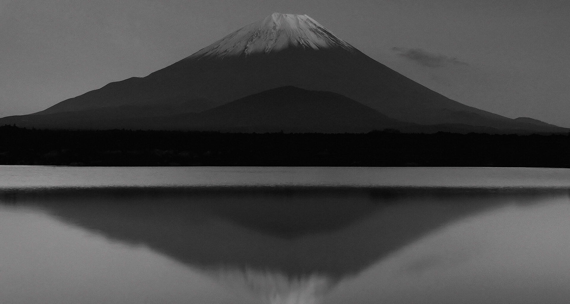 Classic view of Mt Fuji from Lake Shoji, one of Fuji's 5 lakes at twilight.