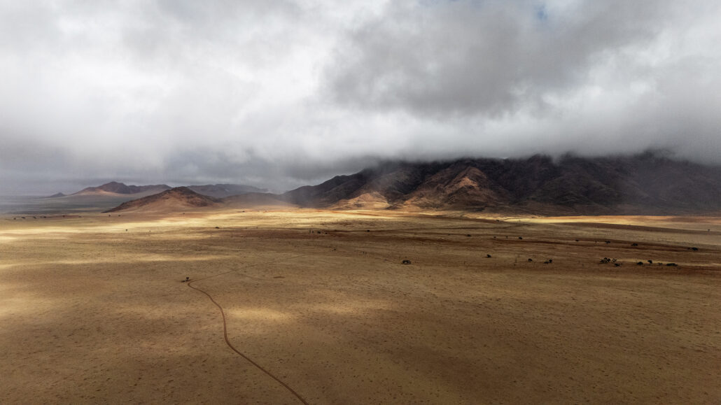 Clouds rolling over the Namibian landscape as a rainstorm approaches on the D707 scenic drive.