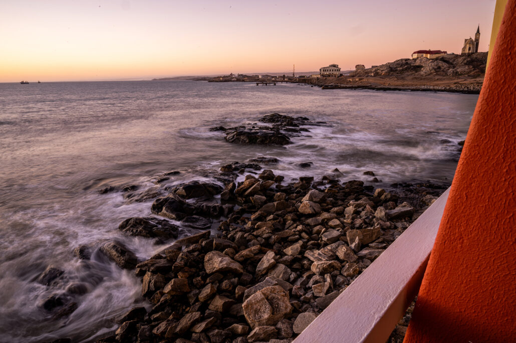 Sunset over the Atlantic Ocean in Luderitz, Namibia.
