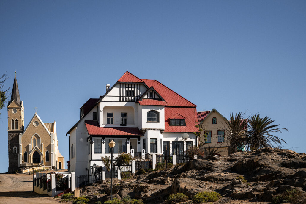 ow of colorful historic homes in Lüderitz, showcasing the town’s German colonial architecture.