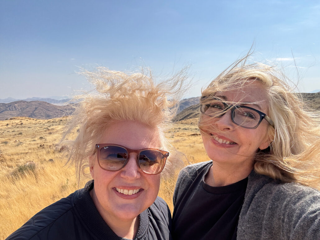 Windy road trip selfie with hair tousled and looking crazy.