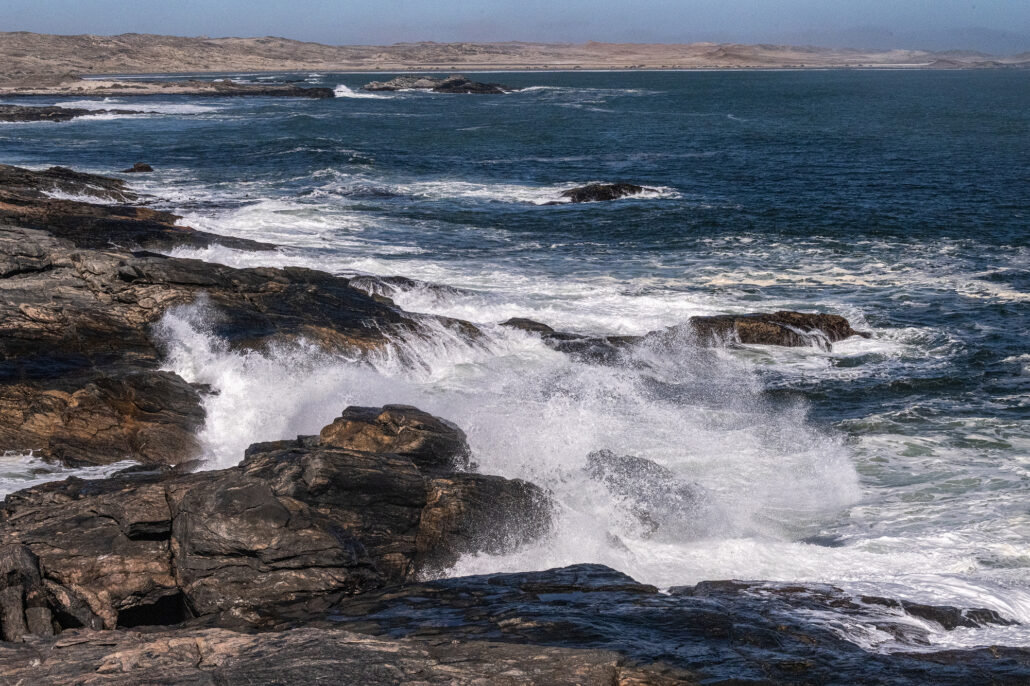 Windswept cliffs and wild sea spray along the rugged coastline of Diaz Point.