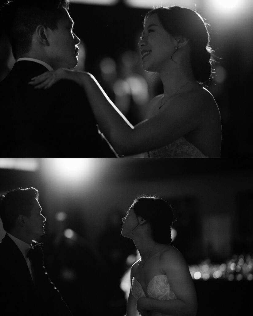 In black and white, the bride smiles up at the groom against a bright backlight, and the couple face each other in silhouette at their first dance in Japan.