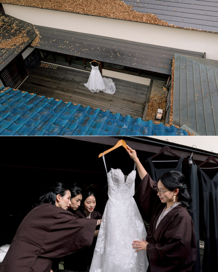 From above, the wedding gown hangs on a veranda beyond a blue tiled roof, and women in dark robes gather around it before a ryokan wedding in Japan.