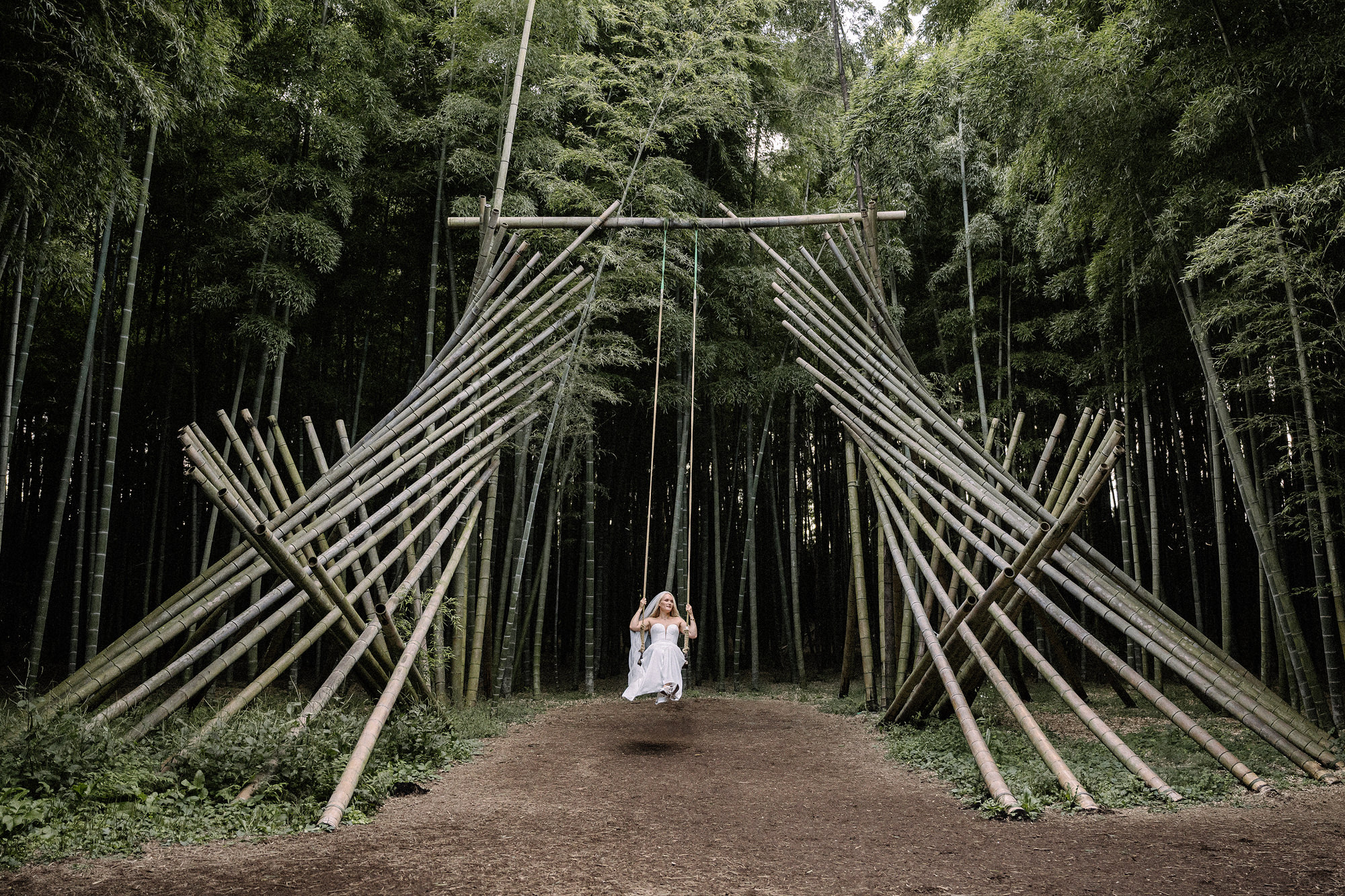 Couple standing in private bamboo forest during intimate wedding ceremony in Tochigi, Japan