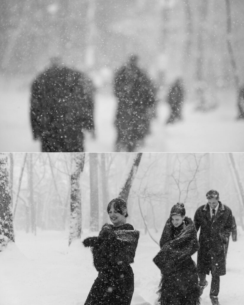 In black and white, guests in dark coats blur into heavy snowfall, and two women in fur wraps laugh through the storm at a Hakuba snow wedding.