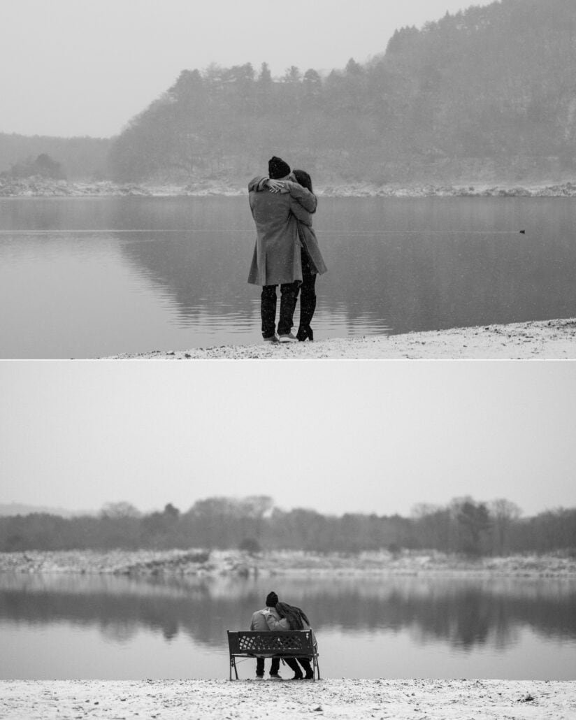 The couple embrace at the edge of a still, snowy Lake Shoji, and sit together on a bench by the water in the Japanese winter.