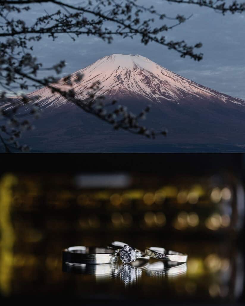 Mt Fuji's snowcap glows pink through bare branches, and the rings for a Mt Fuji wedding sit reflected on a dark surface under warm lights.