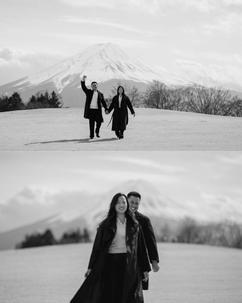 He punches the air after the wedding proposal as they walk back across the hilltop with Mount Fuji behind them, in black and white.