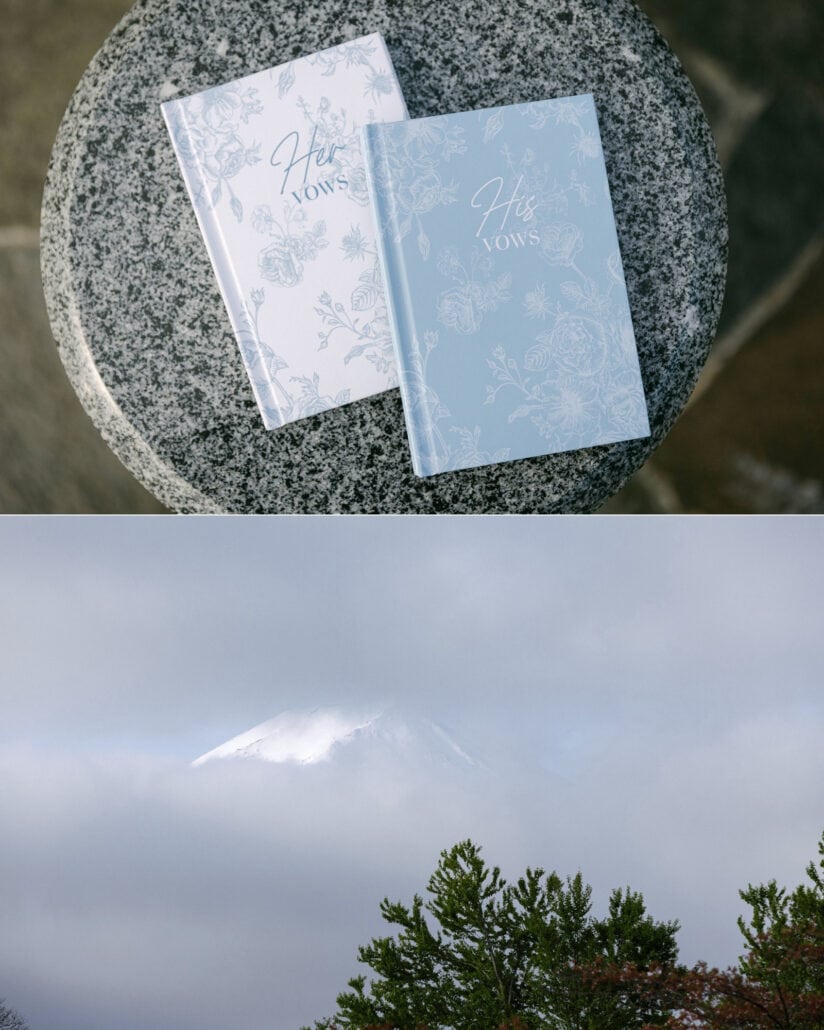 Her Vows and His Vows books in pale blue and white on a granite table, and Mt Fuji's summit still in cloud above the pines at Lake Kawaguchi.