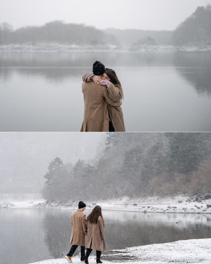 The couple embrace by the lake, and walk the snowy shoreline under misty hills as the snow comes down.