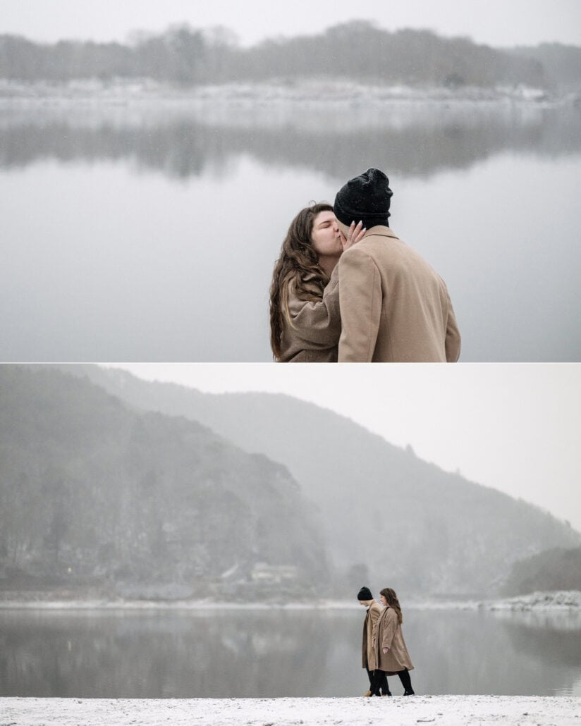 She kisses his cheek by the lake, and the two of them stand small on the snowy shore beneath misty mountains.