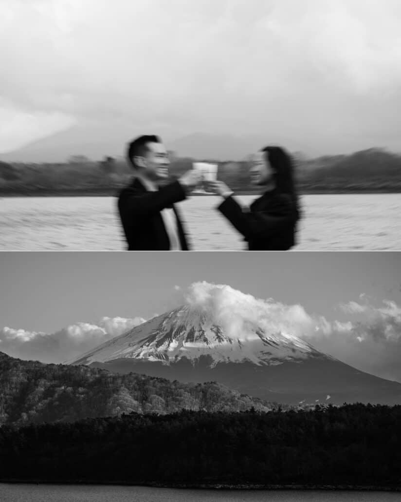 The couple raise their glasses in a toast by the lake, and Mount Fuji wears a cap of cloud above the forest, in black and white.