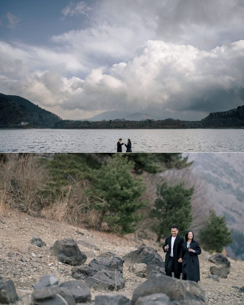 The engaged couple stand small on the shore under a vast cloudy sky at the Fuji Five Lakes, and on a rocky slope among the pines.