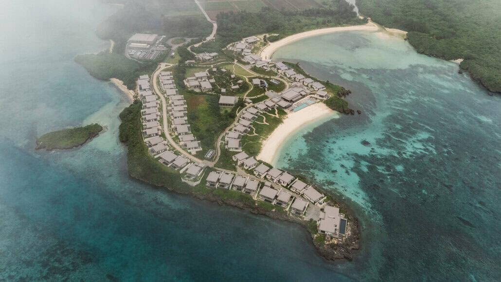 Morning mist drifts over Rosewood Miyakojima, the first Rosewood in Japan, its villas along a peninsula ringed by reef and turquoise water.