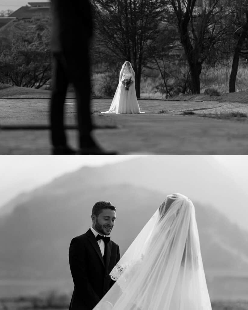 In black and white, the veiled bride holds her bouquet on the path at Lake Kawaguchi, and the groom smiles as he faces her for their first look.