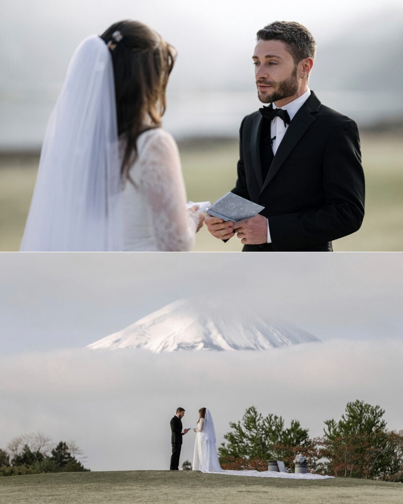 The groom looks up from his pale blue vow book, then the couple read their vows on a grassy knoll at Lake Kawaguchi as Mt Fuji clears the clouds.