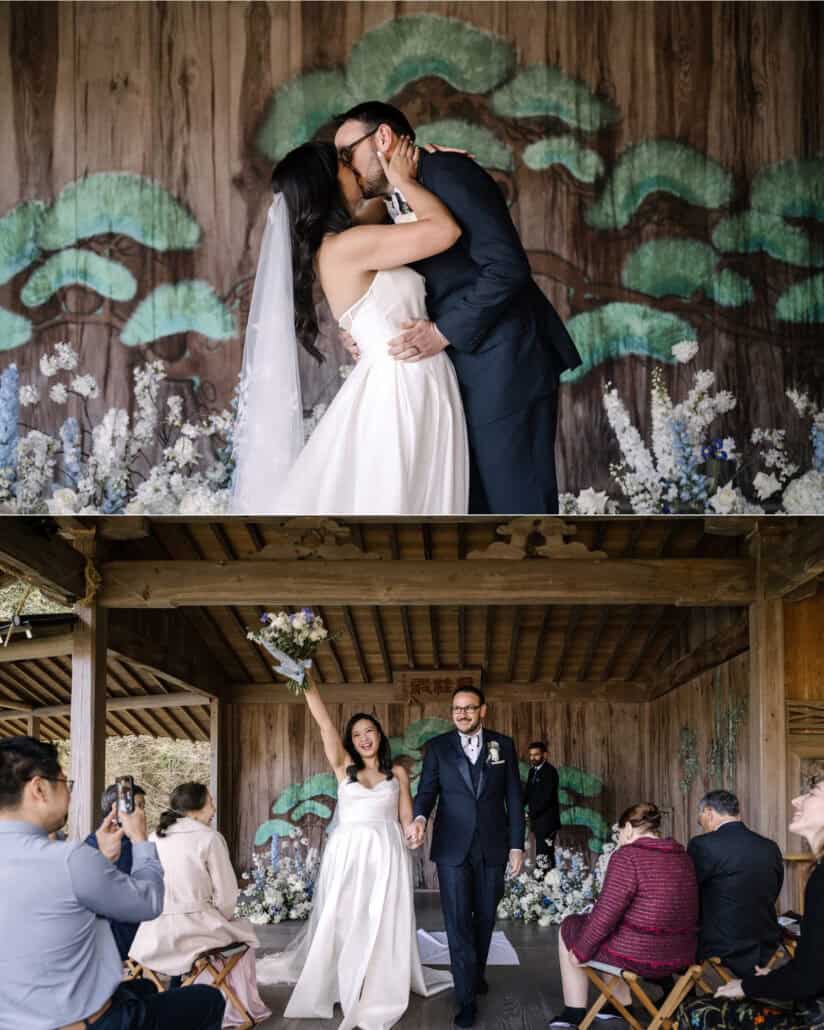 The bride and groom kiss in front of the painted pine on the Noh stage, then walk back up the aisle, bouquet raised, at their Asaba ryokan wedding.