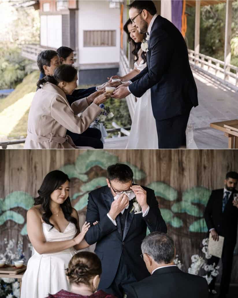 The couple serve tea to their parents in a wedding tea ceremony at Asaba ryokan, and the groom wipes his eyes as the bride rests a hand on his arm.