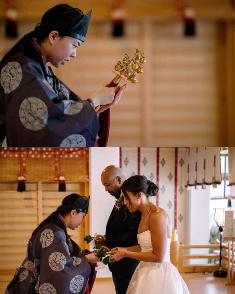 A Shinto priest raises the kagura bells, and hands the bride and groom a sakaki branch to offer at their wedding blessing.