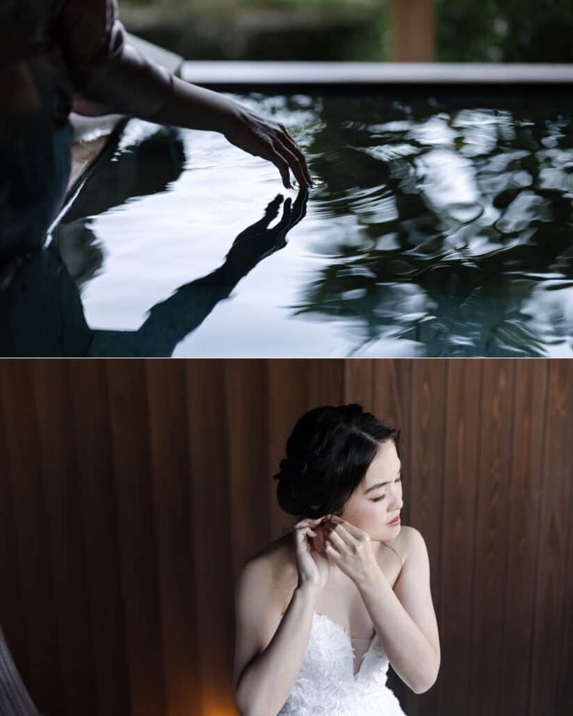 The bride getting ready at the inn, her fingertips touching the water of a private bath, then fastening her earrings against dark wood.
