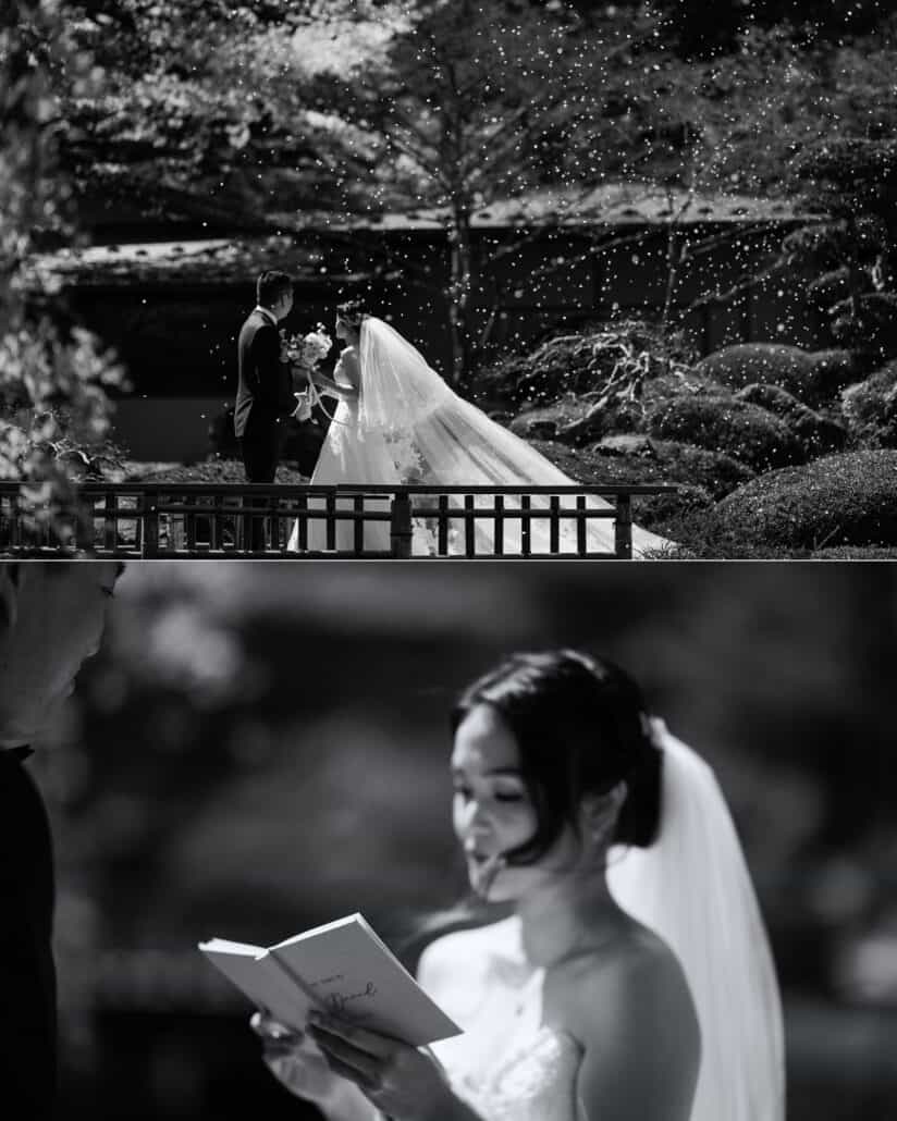 In black and white, petals fall over the couple at their first look on a garden bridge, then the bride reads her vows from a small book.