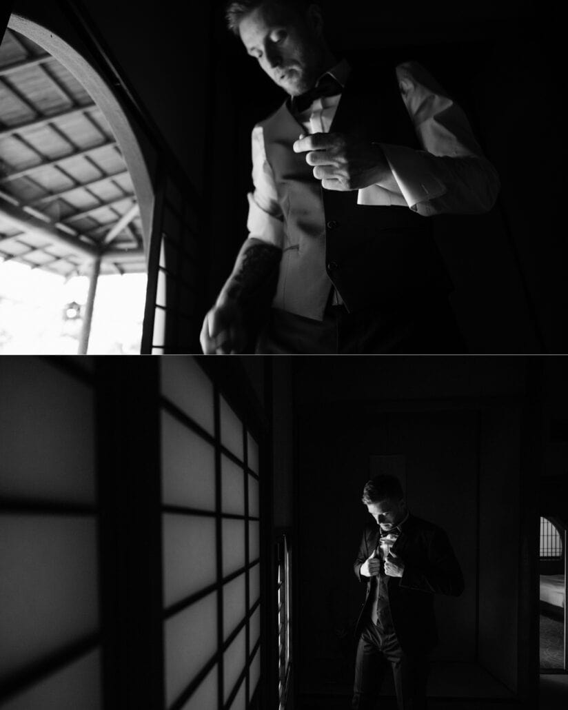 Two black and white frames of the groom fixing his cuff by an arched window, then buttoning his jacket by shoji screens, getting ready at a ryokan.