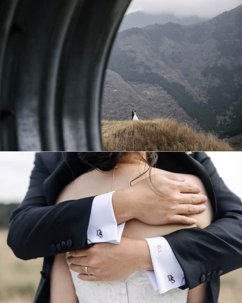 The couple stand small on a dry grass ridge seen through a curved dark arch, then the groom holds her close, monogram cufflinks at his wrists.