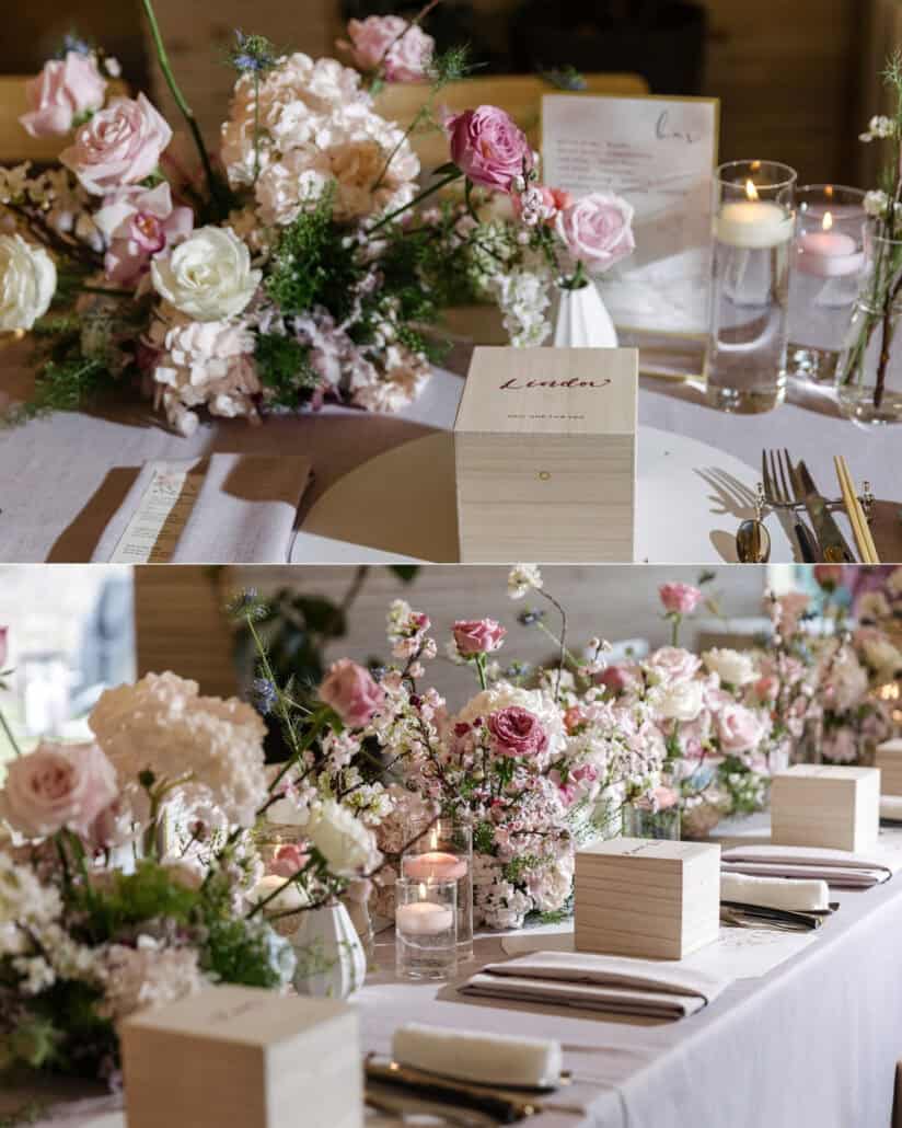 The long dinner table at Fujisan Winery is set with pink roses, blossom branches, floating candles and small wooden gift boxes.