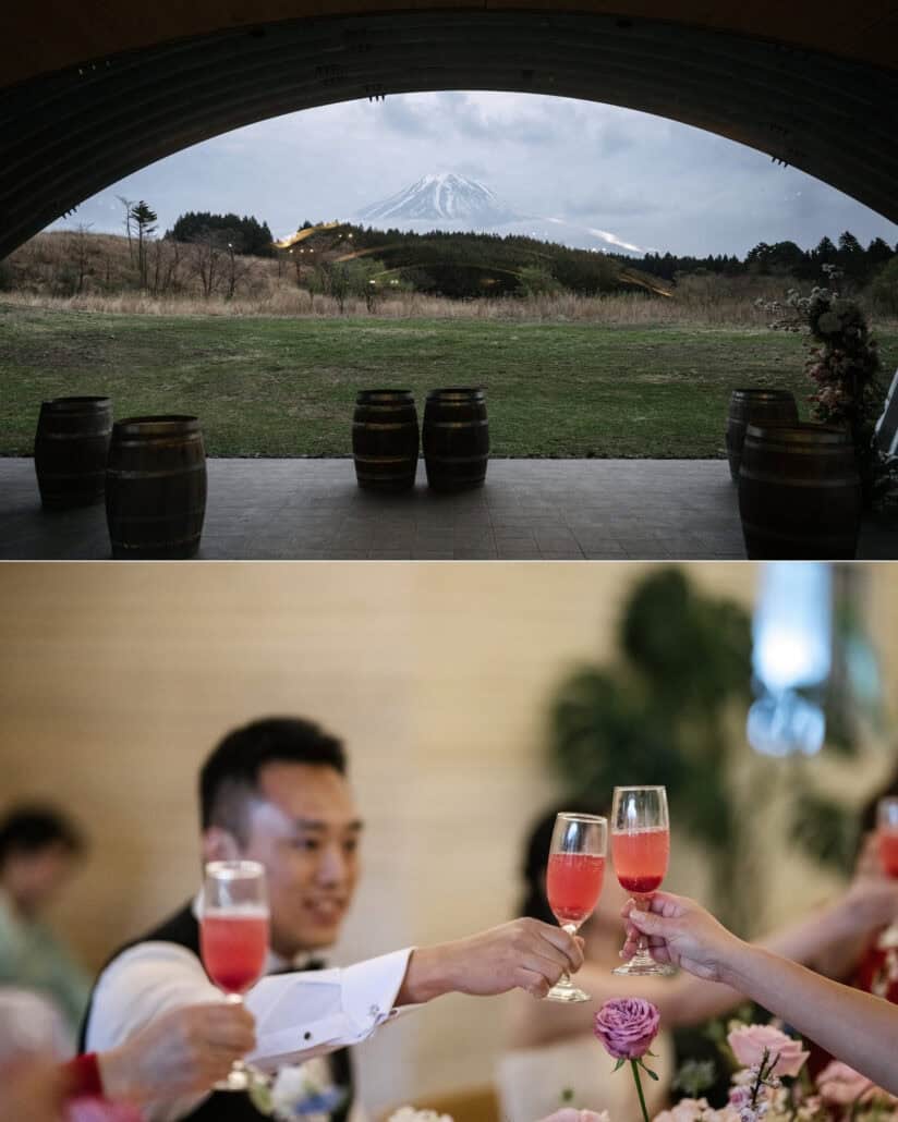 Mt Fuji is framed in the arch beyond wine barrels at Fujisan Winery, a unique wedding venue in Japan, and the groom clinks glasses at dinner.