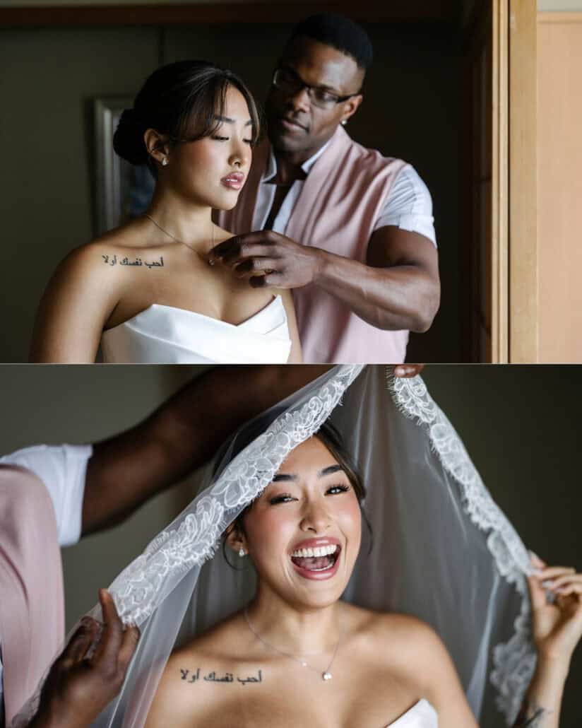 A friend fastens the bride's necklace, then lifts her lace veil as she laughs on the morning of her cherry blossom wedding.