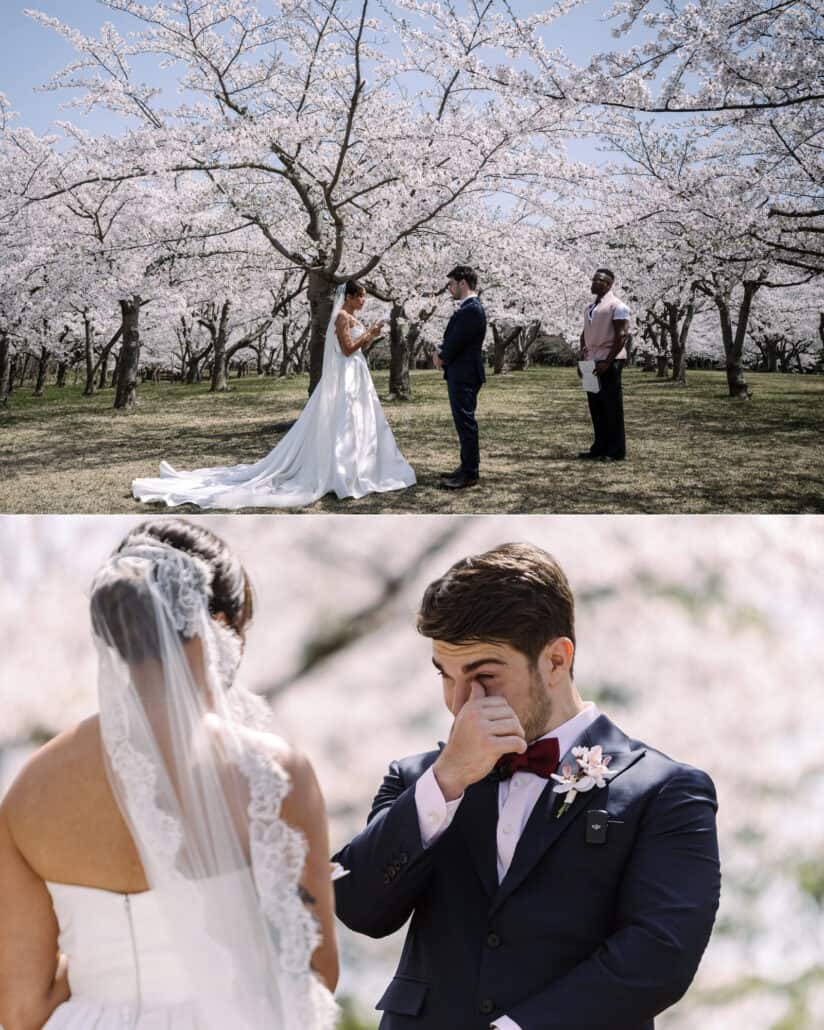 A wide view of the vows beneath the cherry blossoms, and the groom wiping his eye as the bride reads to him.