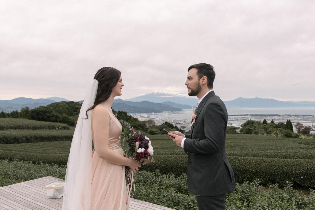 Two weeks after Japan reopened, a couple face each other for their ceremony on the tea deck at Nihondaira, after planning a wedding in Japan without visiting first.