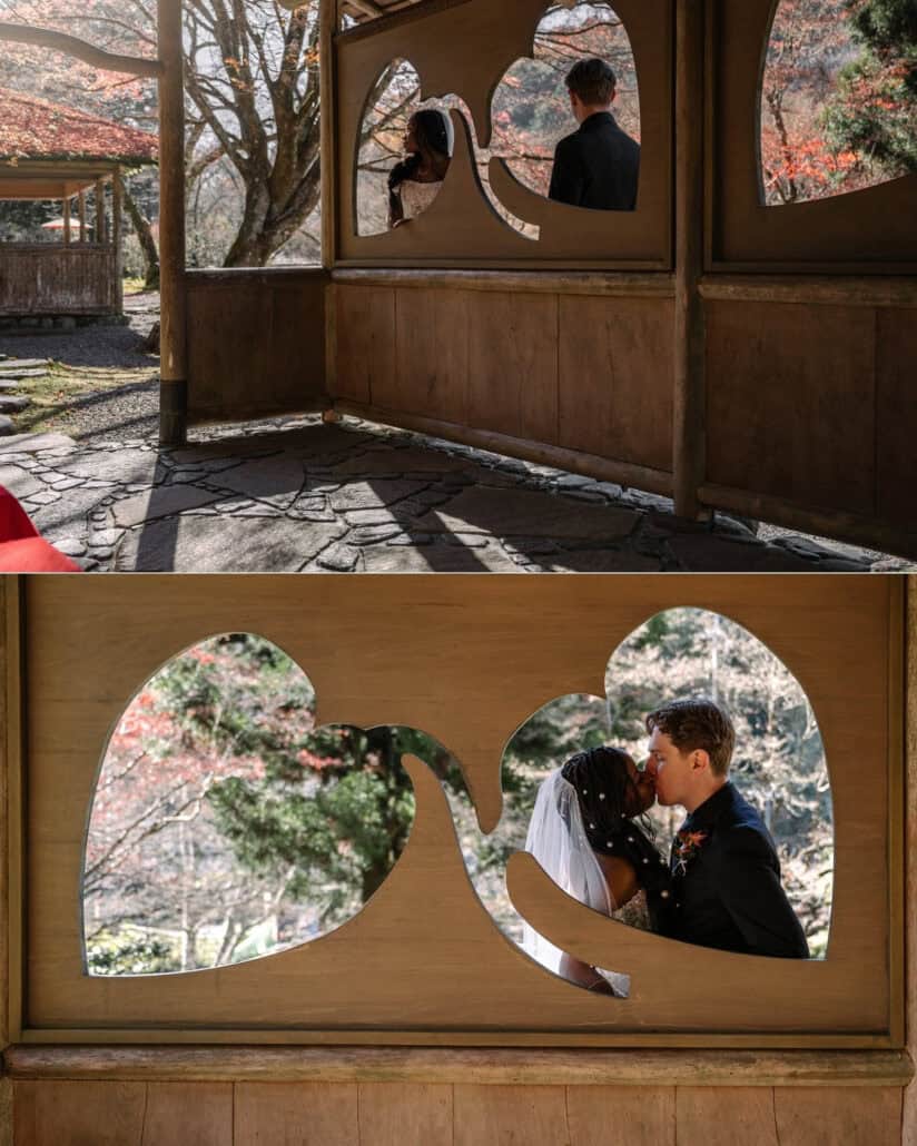 A wooden garden pavilion with heart-shaped windows, and the couple kissing framed in one of the heart shapes in autumn light.