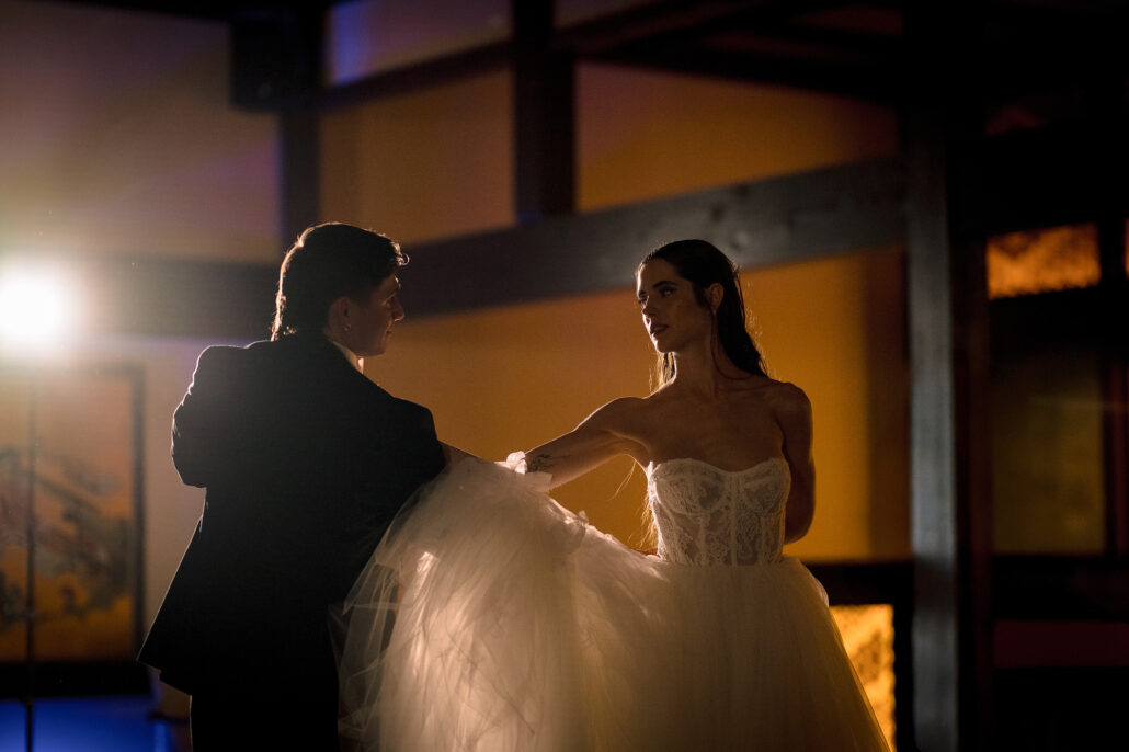 The first dance, a waltz, her ball gown swinging out as they turn.