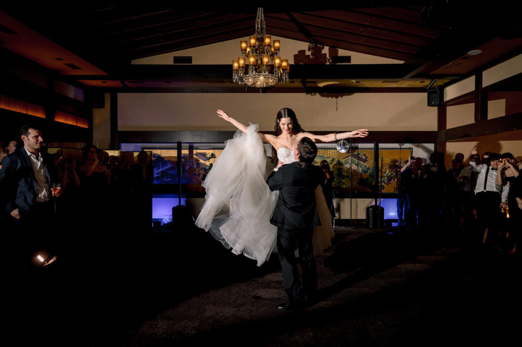The first dance lift in the warm light of the room at Jinya.