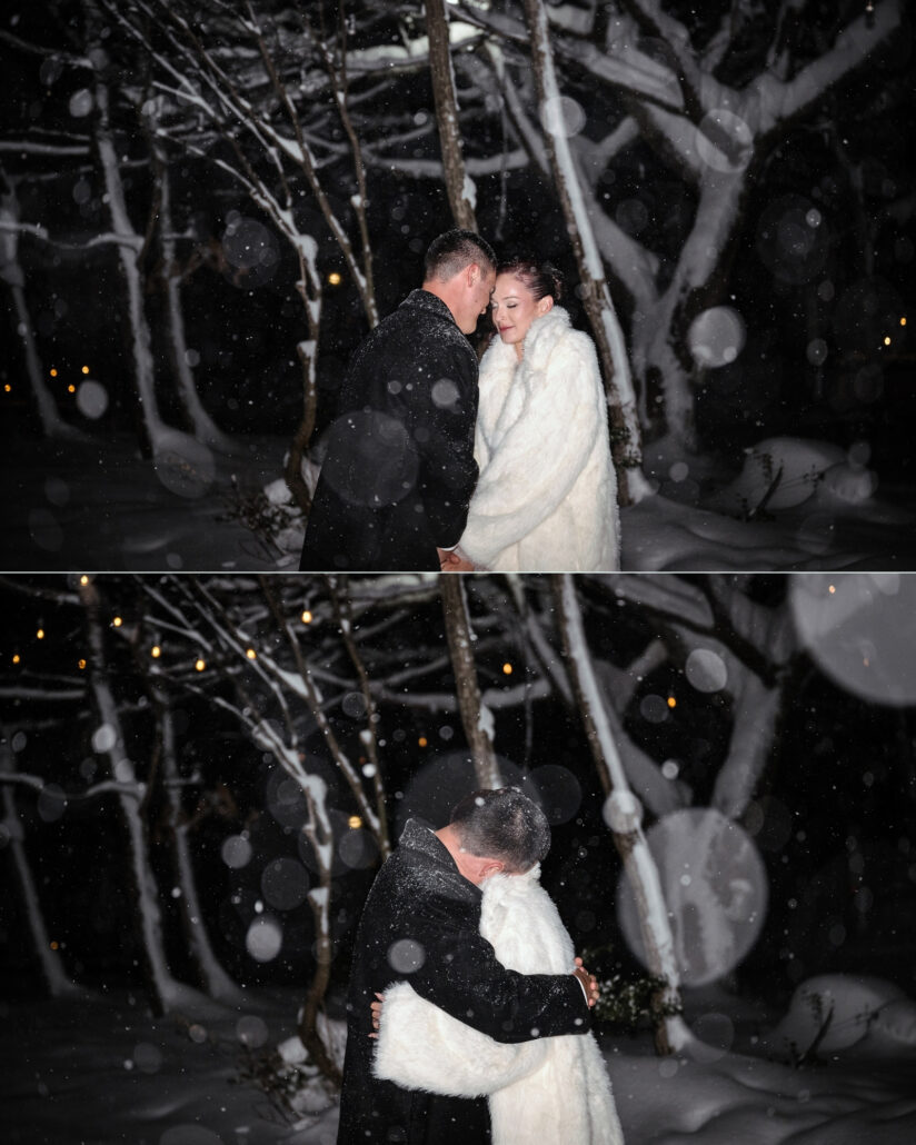 The couple hold each other beneath fairy lights in the snowy trees at night, the bride wrapped in white fur as snow falls.