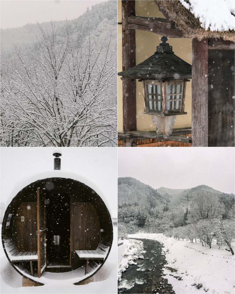 Snow laden trees, a wooden lantern under a snowy roof, a barrel sauna and a river valley on the morning of a snow wedding in Hakuba.