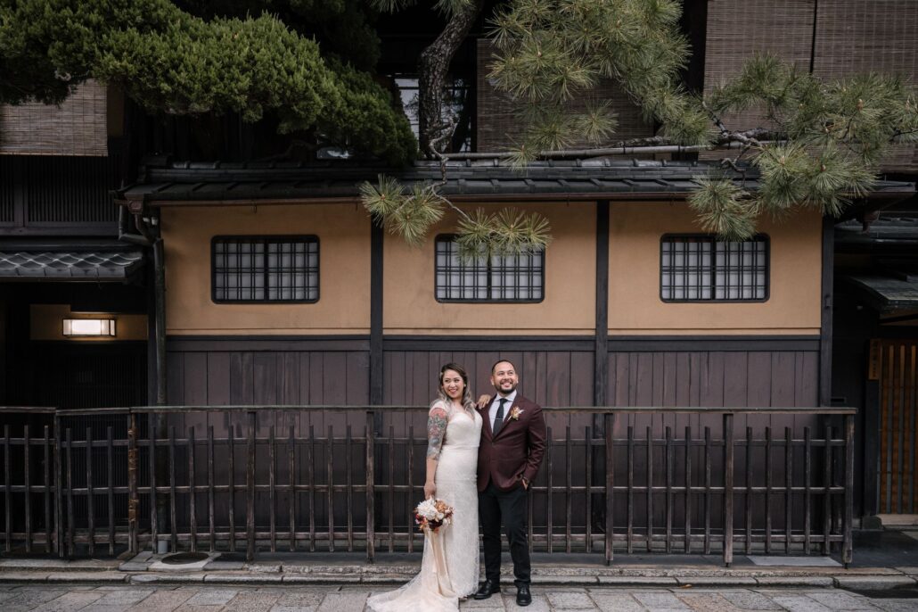 The newlyweds in front of a traditional wooden machiya in Gion.