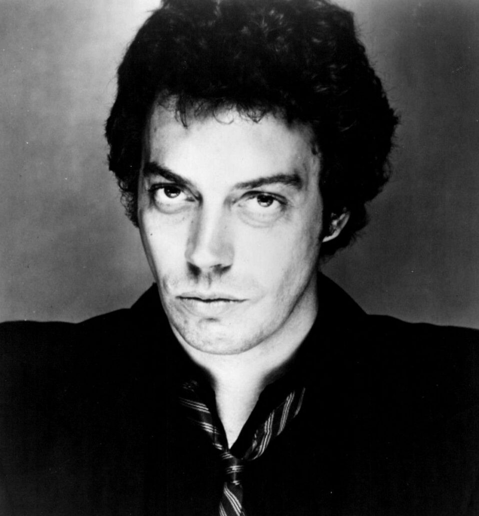 Tim Curry in a black and white publicity portrait from 1978, three years after The Rocky Horror Picture Show.